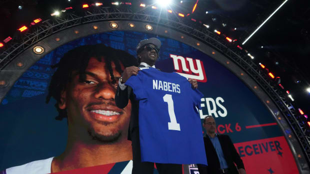 Apr 25, 2024; Detroit, MI, USA; LSU Tigers wide receiver Malik Nabers poses with jersey after being selected as the No. 8 pick by the New York Giants during the 2024 NFL Draft at Campus Martius Park and Hart Plaza. Mandatory Credit: Kirby Lee-USA TODAY Sports
