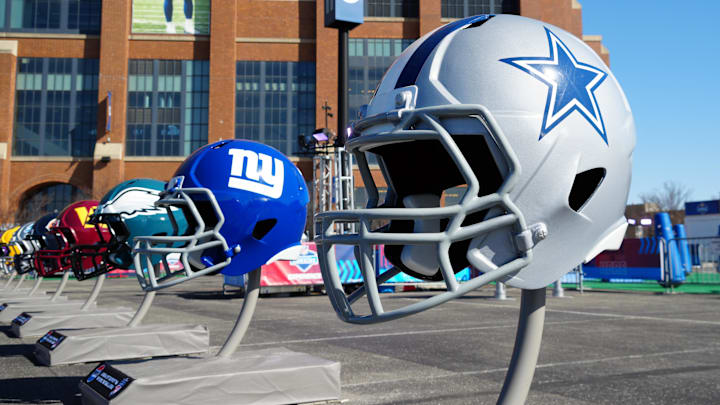A general view of large Dallas Cowboys and New York Giants helmets at the NFL Scouting Combine Experience at Lucas Oil Stadium. 