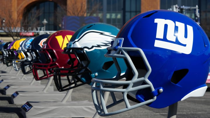 Feb 28, 2024; Indianapolis, IN, USA; A general view of large New York Giants and Philadelphia Eagles helmets at the NFL Scouting Combine Experience at Lucas Oil Stadium. 