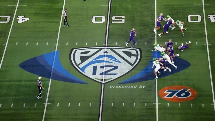 Dec 1, 2023; Las Vegas, NV, USA; A general overall view as Washington Huskies quarterback Michael Penix Jr. (9)] throws the ball at midfield on the Pac-12 Conference logo against the Oregon Ducks in the first half at Allegiant Stadium. Mandatory Credit: Kirby Lee-USA TODAY Sports