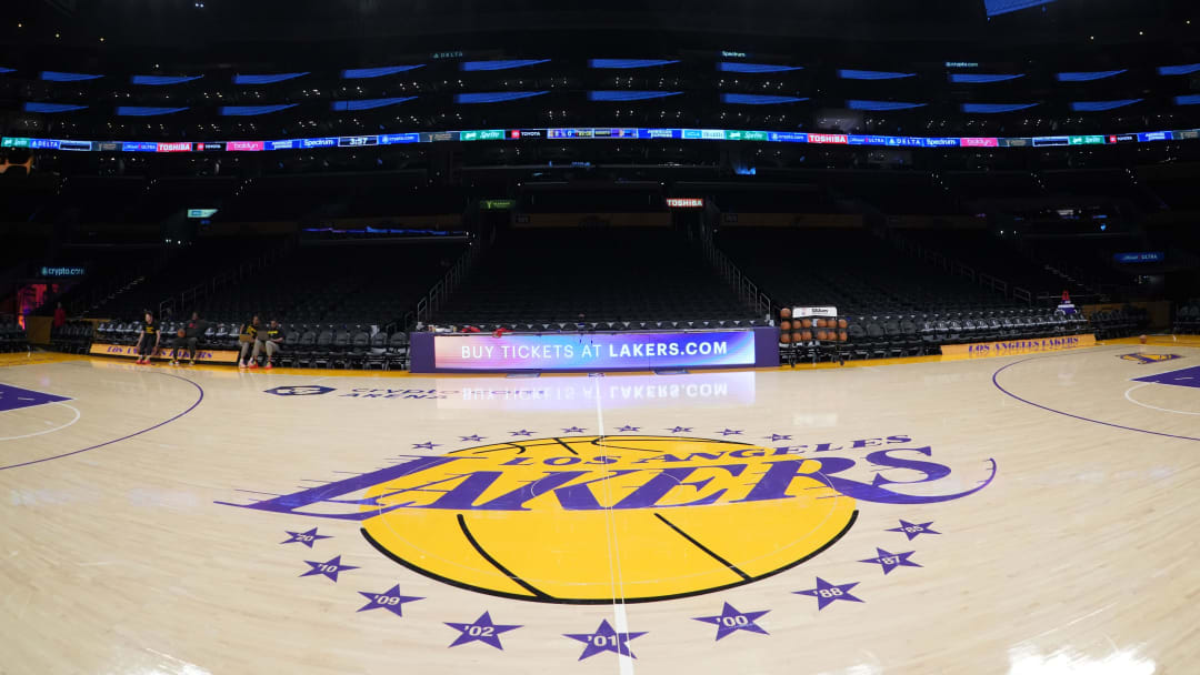 Apr 9, 2024; Los Angeles, California, USA; The Los Angeles Lakers logo at midcourt Crypto.com Arena. Mandatory Credit: Kirby Lee-USA TODAY Sports