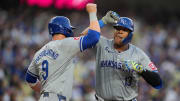 Jun 14, 2024; Los Angeles, California, USA; Kansas City Royals catcher Salvador Perez (13) celebrates with first baseman Vinnie Pasquantino (9) after hitting a three-run home run in the second inning against the Los Angeles Dodgers at Dodger Stadium. Mandatory Credit: Kirby Lee-USA TODAY Sports