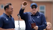 Dallas Cowboys owner Jerry Jones receives a medallion from Oxnard mayor Luis McArthur at NFL training camp