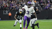 Dec 10, 2023; Paradise, Nevada, USA; Minnesota Vikings wide receiver Jordan Addison (3) carries the ball against Las Vegas Raiders cornerback Jack Jones (18) in the second half at Allegiant Stadium.