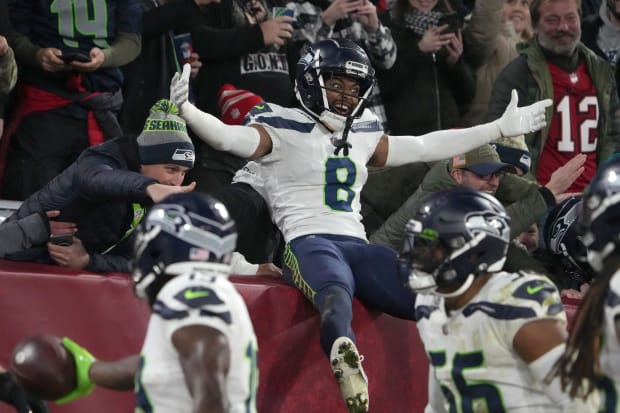 Seattle Seahawks cornerback Coby Bryant (8) celebrates with fans in the second half against the Tampa Bay Buccaneers.