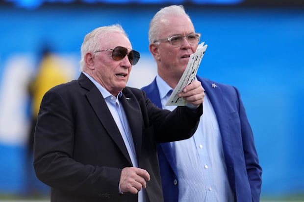 Dallas Cowboys owner Jerry Jones and chief EVP Stephen Jones react before the game against the Los Angeles Chargers.