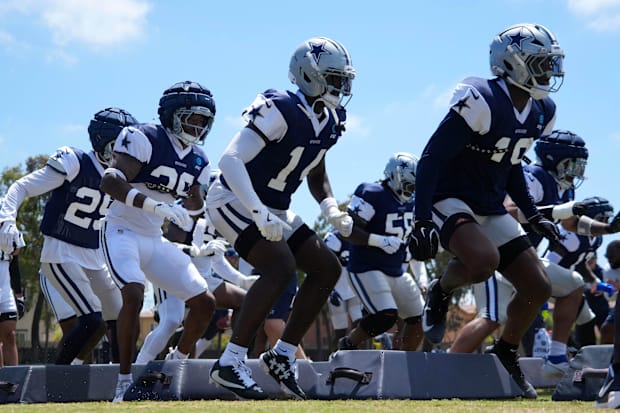 Dallas Cowboys defensive players run drills at training camp at the River Ridge Fields in Oxnard, California. 