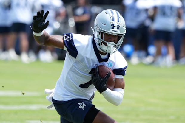 Dallas Cowboys receiver Traeshon Holden carries the ball during training camp at the River Ridge Fields.