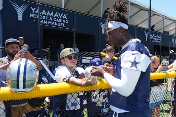 Dallas Cowboys linebacker DeMarvion Overshown signs autographs at training camp at the River Ridge Fields. 