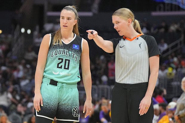 New York Liberty guard Sabrina Ionescu listens to referee Jenna Reneau. 