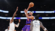 Mar 2, 2025; Phoenix, Arizona, USA; Phoenix Suns guard Devin Booker (1) passes the ball against the Minnesota Timberwolves during the second half at Footprint Center. Mandatory Credit: Joe Camporeale-Imagn Images