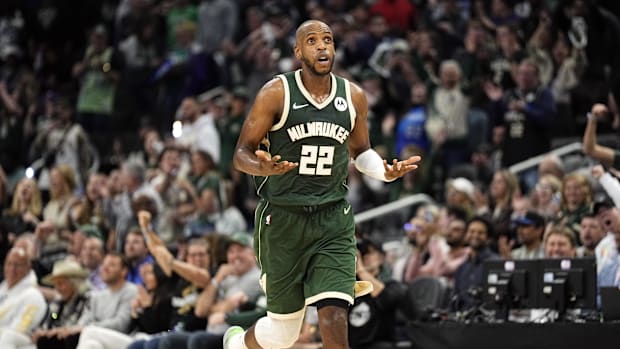 Milwaukee Bucks forward Khris Middleton reacts after scoring a basket against the Indiana Pacers in the 2024 NBA playoffs.