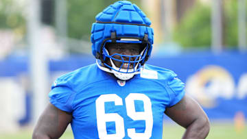 May 28, 2025; Woodland Hills, CA, USA; Los Angeles Rams offensive lineman Kevin Dotson (69) watches an offensive drill during organized team activities at Rams Practice Facility. Mandatory Credit: Kirby Lee-Imagn Images