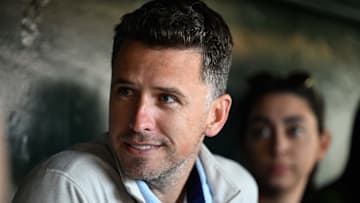 Jun 4, 2025; San Francisco, California, USA; Former San Francisco Giants player Buster Posey sits in the dugout before the game against the San Diego Padres at Oracle Park. 