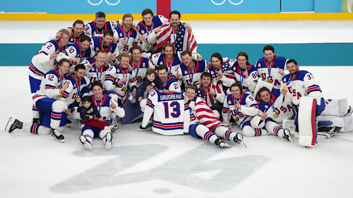 Feb 22, 2026; Milan, Italy; The United States celebrates after winning the men's ice hockey gold medal game during the Milano Cortina 2026 Olympic Winter Games at Milano Santagiulia Ice Hockey Arena. Mandatory Credit: James Lang-Imagn Images