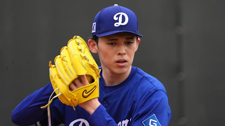 Feb 12, 2025; Glendale, AZ, USA; Los Angeles Dodgers pitcher Roki Sasaki (11) throws during a Spring Training workout at Camelback Ranch. Mandatory Credit: Joe Camporeale-Imagn Images Feb 12, 2025; Glendale, AZ, USA; Los Angeles Dodgers pitcher Roki Sasaki (11) throws during a Spring Training workout at Camelback Ranch. Mandatory Credit: Joe Camporeale-Imagn Images