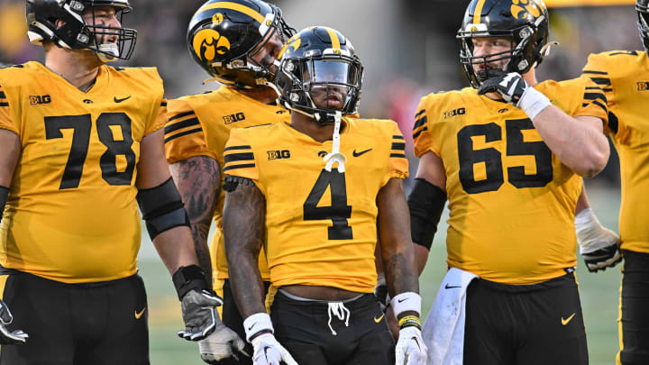 Oct 21, 2023; Iowa City, Iowa, USA; Iowa Hawkeyes running back Leshon Williams (4) and offensive lineman Mason Richman (78) and offensive lineman Logan Jones (65) look on during the game against the Minnesota Golden Gophers at Kinnick Stadium. Mandatory Credit: Jeffrey Becker-USA TODAY Sports