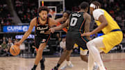 Mar 20, 2024; Detroit, Michigan, USA; Detroit Pistons guard Cade Cunningham (2) drives to the basket as teammate center Jalen Duren (0) sets a pick on Indiana Pacers forward Aaron Nesmith (23) in the first half at Little Caesars Arena. Mandatory Credit: David Reginek-Imagn Images