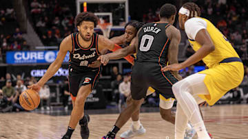 Mar 20, 2024; Detroit, Michigan, USA; Detroit Pistons guard Cade Cunningham (2) drives to the basket as teammate center Jalen Duren (0) sets a pick on Indiana Pacers forward Aaron Nesmith (23) in the first half at Little Caesars Arena. Mandatory Credit: David Reginek-Imagn Images