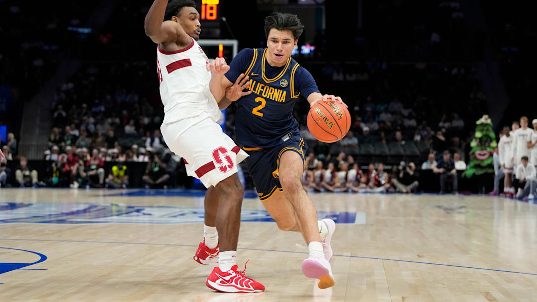 Mar 12, 2025; Charlotte, NC, USA; California Golden Bears guard Andrej Stojakovic (2) with the ball as Stanford Cardinal guard Jaylen Blakes (21) defends in the second half at Spectrum Center. Mandatory Credit: Bob Donnan-Imagn Images
