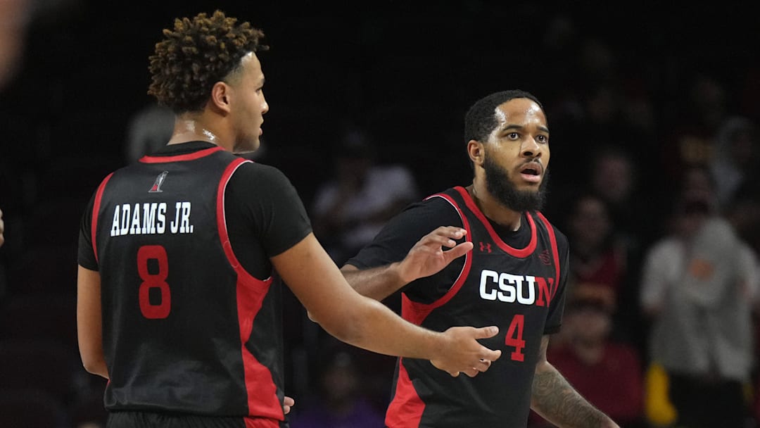 Dec 18, 2024; Los Angeles, California, USA; Cal State Northridge Matadors forward Marcus Adams Jr. (8) and guard PJ Fuller II (4) react in the first half against the Southern California Trojans at Galen Center. Mandatory Credit: Kirby Lee-Imagn Images