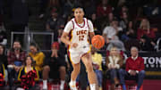 Dec 29, 2024; Los Angeles, California, USA; Southern California Trojans guard JuJu Watkins (12) dribbles the ball against the Michigan Wolverines in the first half at Galen Center. Mandatory Credit: Kirby Lee-Imagn Images
