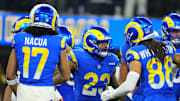 Dec 28, 2024; Inglewood, California, USA; Los Angeles Rams running back Kyren Williams (23) celebrates with wide receiver Jordan Whittington (88) and wide receiver Puka Nacua (17) after scoring on a 1-yard touchdown run against the Arizona Cardinals in the first half at SoFi Stadium. Mandatory Credit: Kirby Lee-Imagn Images