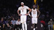 Dec 15, 2024; Los Angeles, California, USA; Los Angeles Lakers forward Anthony Davis (3) and forward LeBron James (23) react in the first half against the Memphis Grizzlies at Crypto.com Arena. Mandatory Credit: Kirby Lee-Imagn Images