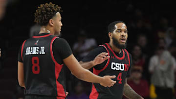 Dec 18, 2024; Los Angeles, California, USA; Cal State Northridge Matadors forward Marcus Adams Jr. (8) and guard PJ Fuller II (4) react in the first half against the Southern California Trojans at Galen Center. Mandatory Credit: Kirby Lee-Imagn Images