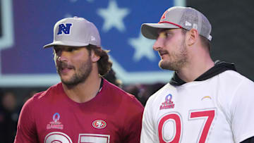 Jan 30, 2025; Orlando, FL, USA; NFC defensive end Nick Bosa of the San Francisco 49ers (left) with brother and AFC linebacker Joey Bosa during the Pro Bowl Skills Challenge at Nicholson Fieldhouse. Mandatory Credit: Kirby Lee-Imagn Images