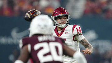Dec 27, 2024; Las Vegas, NV, USA; Southern California Trojans quarterback Jayden Maiava (14) throws the ball against Texas A&M Aggies defensive back BJ Mayes (20) in the first half at Allegiant Stadium. Mandatory Credit: Kirby Lee-Imagn Images