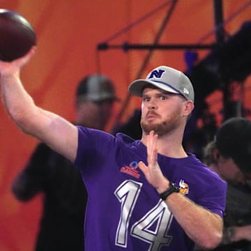 Jan 30, 2025; Orlando, FL, USA; NFC quarterback Sam Darnold (14) throws the ball in the Passing the Test event during the Pro Bowl Skills Challenge at Nicholson Fieldhouse. Mandatory Credit: Kirby Lee-Imagn Images
