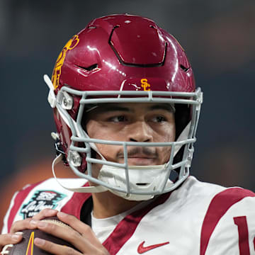 Dec 27, 2024; Las Vegas, NV, USA; Southern California Trojans quarterback Jayden Maiava (14) throws the ball against the Texas A&M Aggies in the first half at Allegiant Stadium. Mandatory Credit: Kirby Lee-Imagn Images