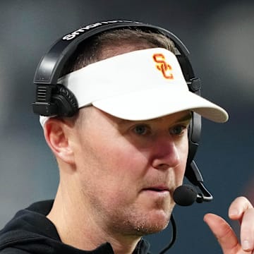 Dec 27, 2024; Las Vegas, NV, USA; Southern California Trojans head coach Lincoln Riley reacts against the Texas A&M Aggies in the second half at Allegiant Stadium. Mandatory Credit: Kirby Lee-Imagn Images