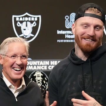 Jan 27, 2025; Las Vegas, NV, USA; Las Vegas Raiders defensive end Maxx Crosby (right) and coach Pete Carroll at press conference at Intermountain Health Performance Center. Mandatory Credit: Kirby Lee-Imagn Images
