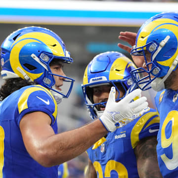 Dec 8, 2024; Inglewood, California, USA; Los Angeles Rams wide receiver Puka Nacua (17) celebrates with quarterback Matthew Stafford (9) and running back Kyren Williams (23) after scoring on a 4-yard touchdown run in the second quarter against the Buffalo Bills at SoFi Stadium. Mandatory Credit: Kirby Lee-Imagn Images