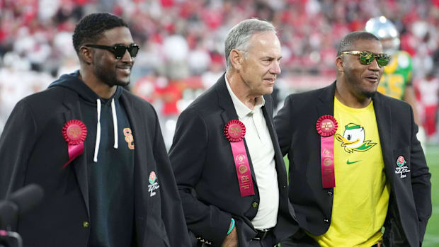 Rose Bowl Hall of Fame inductees Reggie Bush (left), Mark Dantonio (center) and LaMichael James during a CFP Quarterfinal at 