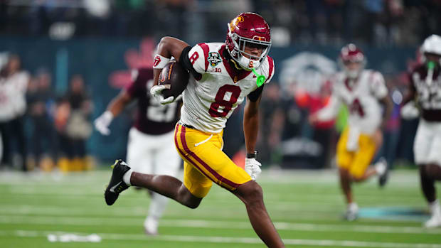 Dec 27, 2024; Las Vegas, NV, USA; Southern California Trojans wide receiver Ja'Kobi Lane (8) carries the ball against the Tex
