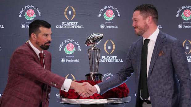Los Angeles, California, USA; Ohio State Buckeyes head coach Ryan Day (left) and Oregon Ducks head coach Dan Lanning shake ha