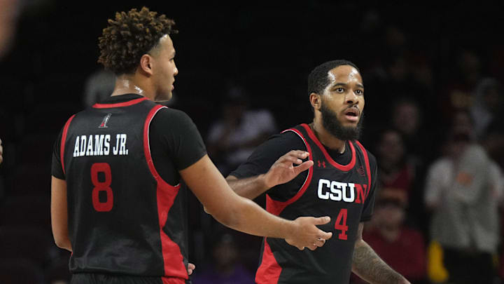 Dec 18, 2024; Los Angeles, California, USA; Cal State Northridge Matadors forward Marcus Adams Jr. (8) and guard PJ Fuller II (4) react in the first half against the Southern California Trojans at Galen Center. Mandatory Credit: Kirby Lee-Imagn Images