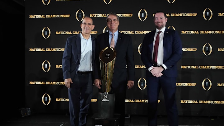Jan 21, 2025; Atlanta, GA, USA; Miami 2026 College Football playoff host committee members Eric Poms (left), Jack Seiler (center) and Will Oster pose during the CFP National Championship Host Committee handoff press conference at The Westin Peachtree Plaza, Savannah Ballroom. Mandatory Credit: Kirby Lee-Imagn Images