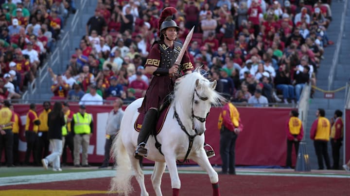Nov 30, 2024; Los Angeles, California, USA; Southern California Trojans white horse mascot Traveler with female rider Dana Kanstul during the game against the Notre Dame Fighting Irish at United Airlines Field at Los Angeles Memorial Coliseum. Mandatory Credit: Kirby Lee-Imagn Images