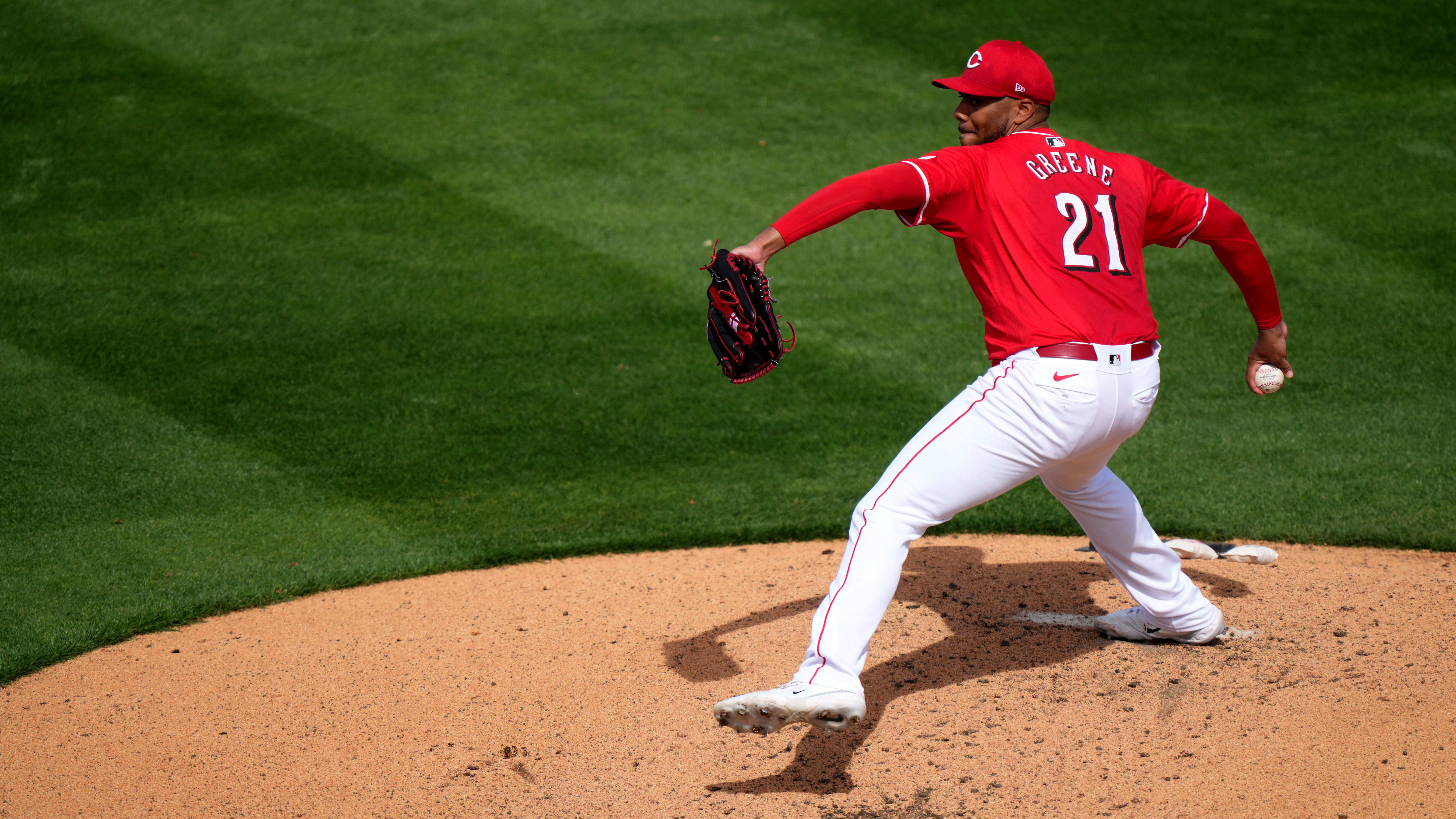 Cincinnati Reds starting pitcher Hunter Greene (21) delivers a pitch in a Spring Training game.