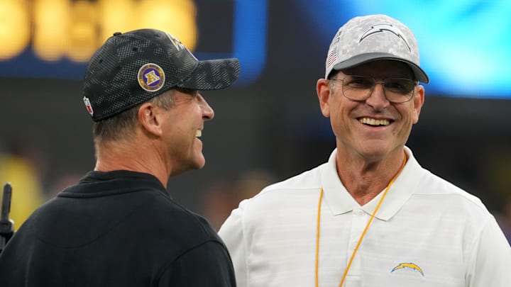 Baltimore Ravens coach John Harbaugh with brother and Los Angeles Chargers coach Jim Harbaugh.