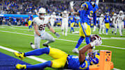 Dec 28, 2024; Inglewood, California, USA; Los Angeles Rams cornerback Ahkello Witherspoon (4) intercepts a pass with 42 seconds left against the Arizona Cardinals at SoFi Stadium. Mandatory Credit: Kirby Lee-Imagn Images