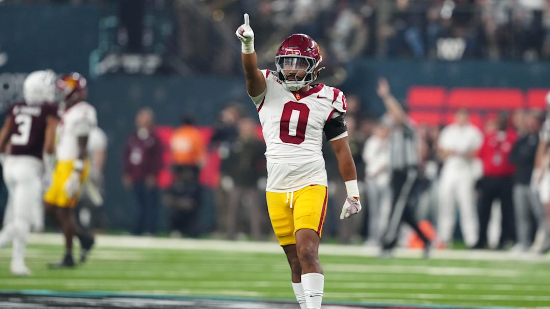 Dec 27, 2024; Las Vegas, NV, USA; Southern California Trojans safety Akili Arnold (0) reacts against the Texas A&M Aggies in the first half at Allegiant Stadium. Mandatory Credit: Kirby Lee-Imagn Images