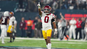 Dec 27, 2024; Las Vegas, NV, USA; Southern California Trojans safety Akili Arnold (0) reacts against the Texas A&M Aggies in the first half at Allegiant Stadium. Mandatory Credit: Kirby Lee-Imagn Images