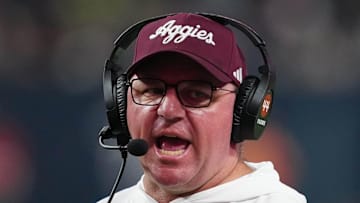 Dec 27, 2024; Las Vegas, NV, USA; Texas A&M Aggies head coach Mike Elko reacts against the Southern California Trojans in the second half at Allegiant Stadium. Mandatory Credit: Kirby Lee-Imagn Images
