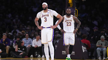 Dec 15, 2024; Los Angeles, California, USA; Los Angeles Lakers forward Anthony Davis (3) and forward LeBron James (23) react in the first half against the Memphis Grizzlies at Crypto.com Arena. Mandatory Credit: Kirby Lee-Imagn Images