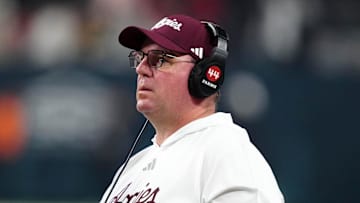 Dec 27, 2024; Las Vegas, NV, USA; Texas A&M Aggies head coach Mike Elko reacts against the Southern California Trojans in the second half at Allegiant Stadium. Mandatory Credit: Kirby Lee-Imagn Images